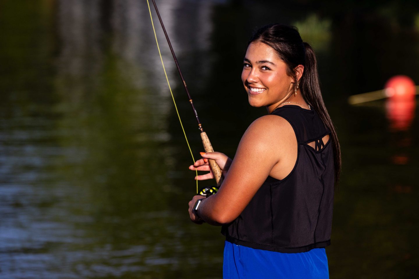 Delaney Madson of Lincoln fly-fishes from the bank at Rockford Lake SRA.