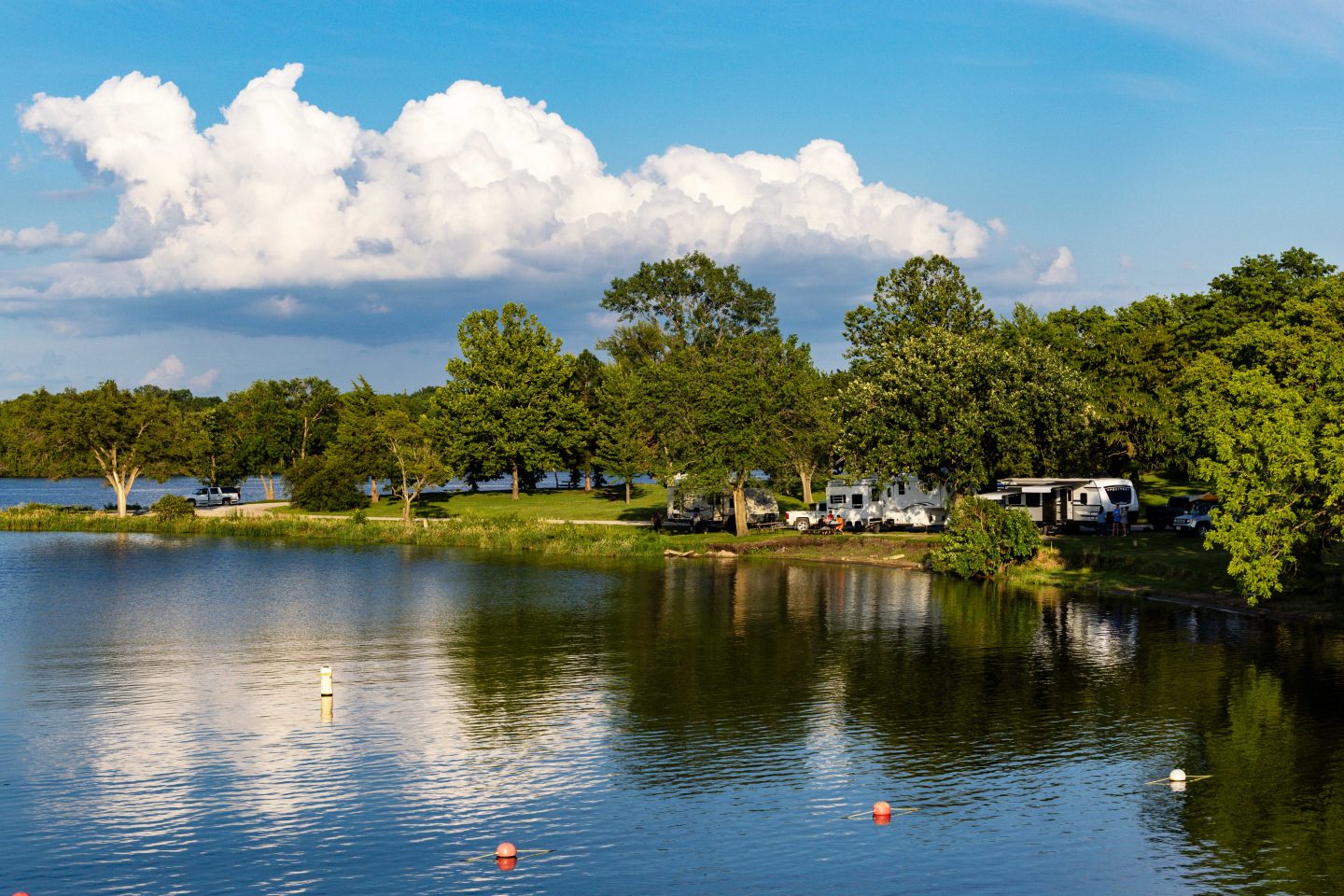 People recreate at their RV campers at Rockford Lake.