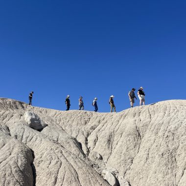 People on a landform at Toadstool Geological Park.