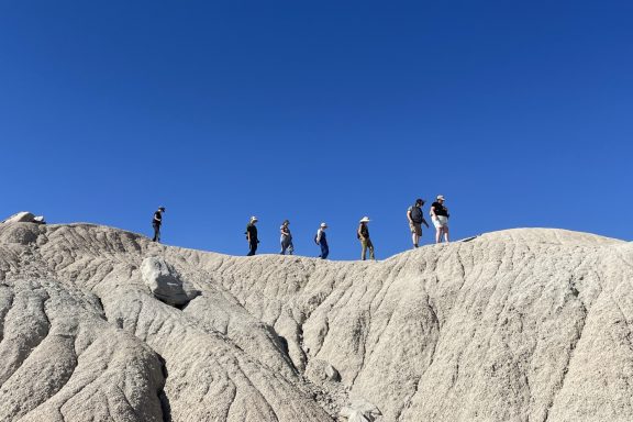 People on a landform at Toadstool Geological Park.