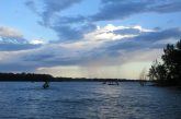 Early morning fishing boats on a reservoir.