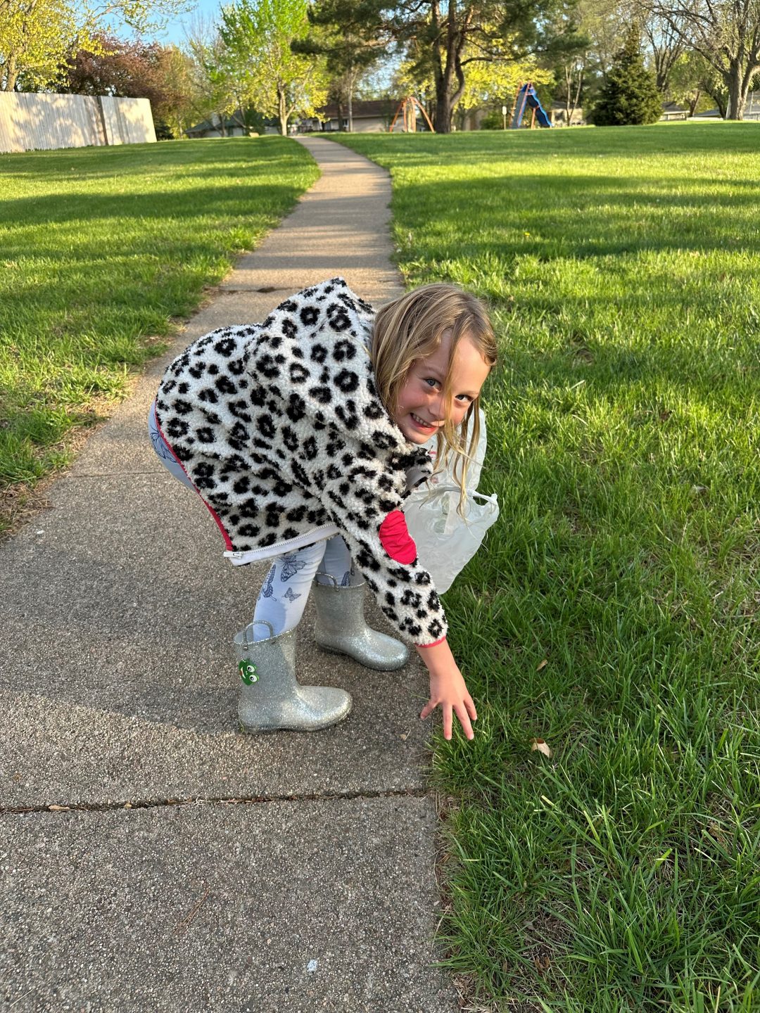 a child picking up trash