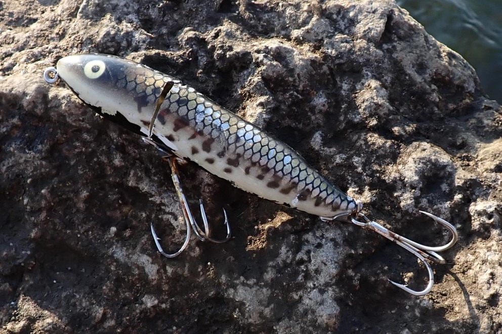 Fishing lure on a rock. Photo by Daryl Bauer, Nebraska Game & Parks Commission.