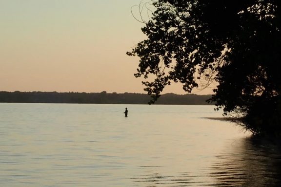 Wading angler. Photo by Daryl Bauer, Nebraska Game & Parks Commission.