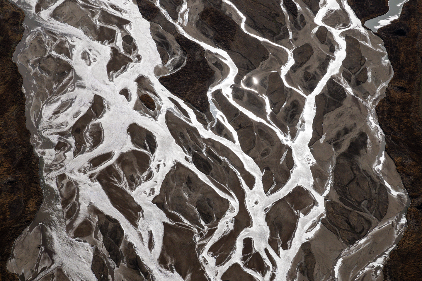 The braided channels of the Platte River in central Nebraska near Rowe Sanctuary provide critical stopover habitat for whooping cranes along their migration through the Central Flyway.