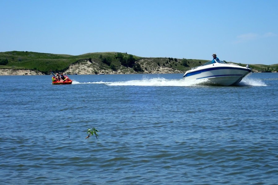 Boat pulling a tube. Photo by Daryl Bauer, Nebraska Game & Parks Commission.