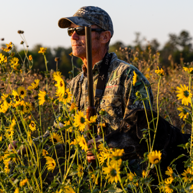 Todd Mills and his 11-year-old Labrador retriever, Hope, hunting teal from a Platte River sandbar in Hall County.