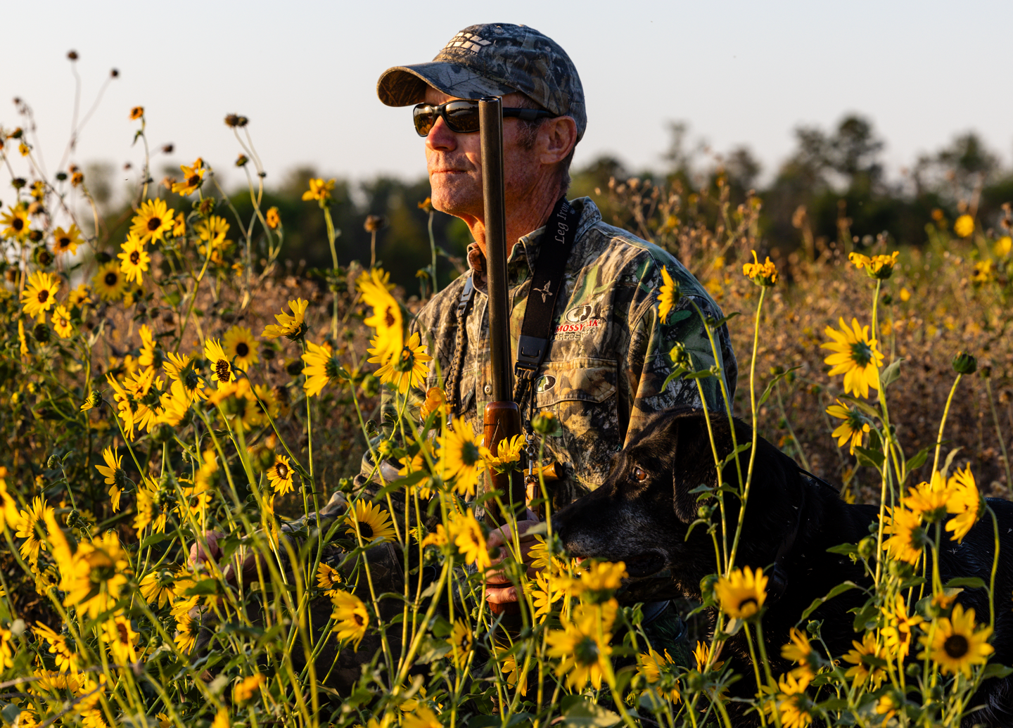 Todd Mills and his 11-year-old Labrador retriever, Hope, hunting teal from a Platte River sandbar in Hall County.
