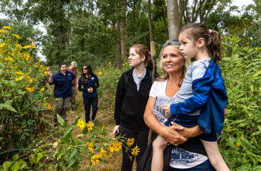 Kelsey Wood, Luanne Wood and Oliver Wood of Millard look out onto the Platte River during a Homeschool Hike.