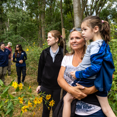 Kelsey Wood, Luanne Wood and Oliver Wood of Millard look out onto the Platte River during a Homeschool Hike.