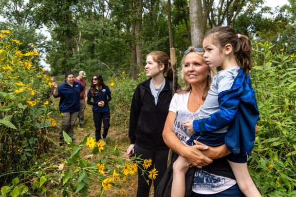 Kelsey Wood, Luanne Wood and Oliver Wood of Millard look out onto the Platte River during a Homeschool Hike.