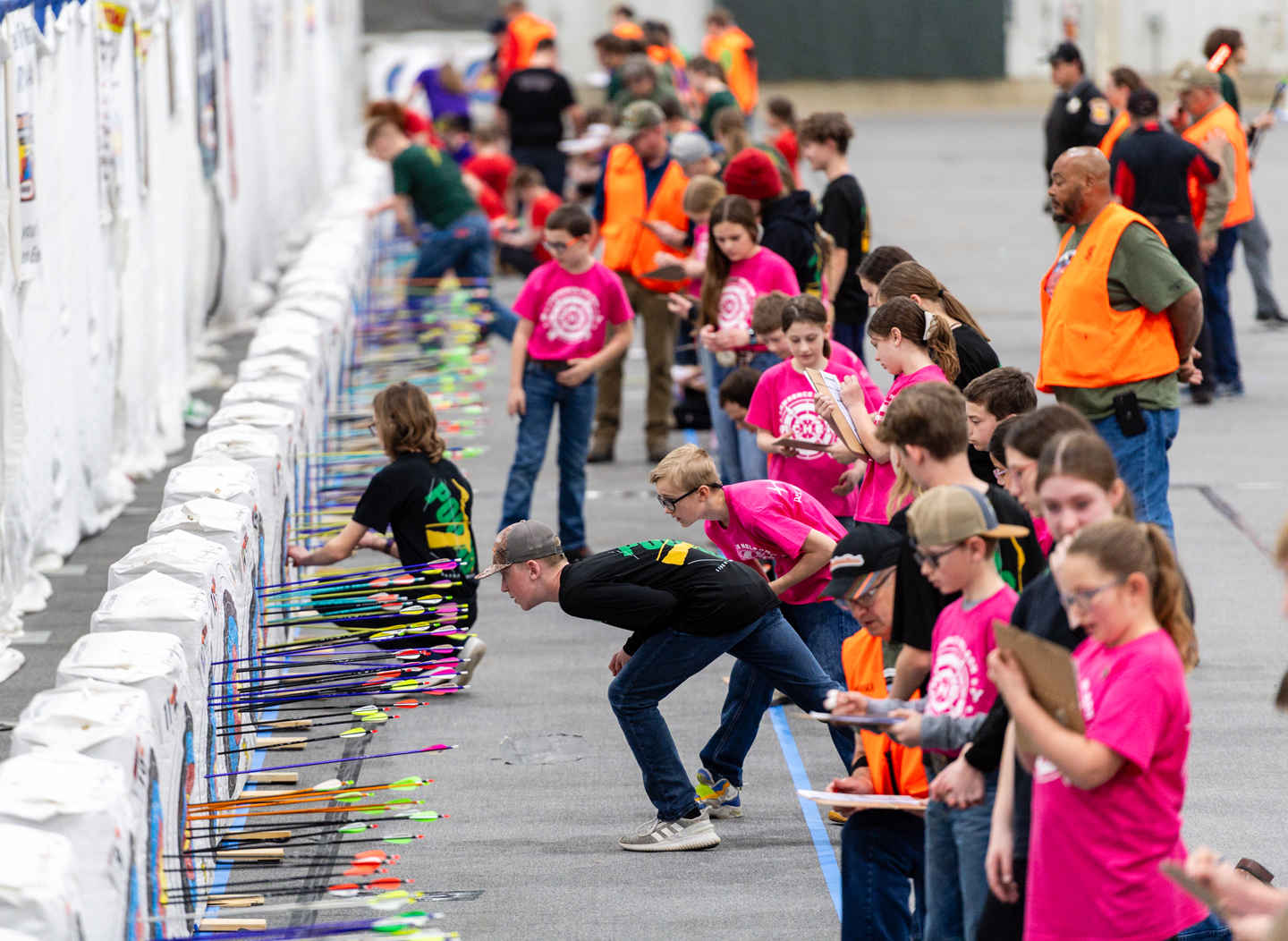 Archers score their targets during the 2024 Nebraska National Archery in the Schools Program State Tournament.