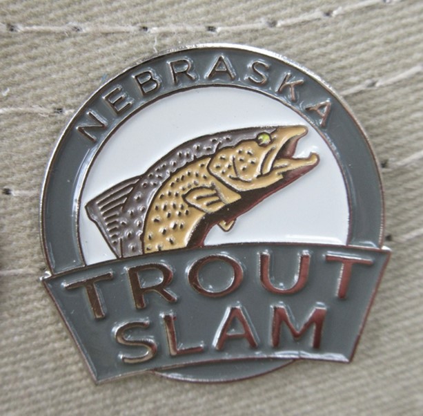 Trout slam pin.  Photo by Daryl Bauer, Nebraska Game & Parks Commission.