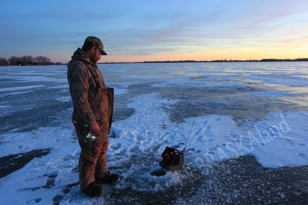 Angler on ice.  Photo by Julie Geiser, Nebraskaland Magazine.