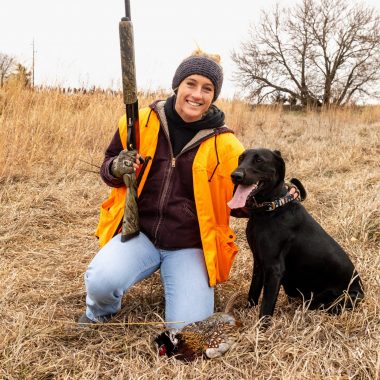 Jordy Bahl and her Labrador retriever, Remi, pause during an Otoe County pheasant hunt, after Remi’s first retrieve.