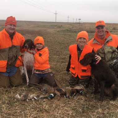 Justin Stofer, his German shorthair, Mojo, son Teegan, Soren Frahm, pudelpointer Penny and Shane Frahm after a day of hunting in Saline, Thayer and Fillmore counties. Photo courtesy of Justin Stofer.