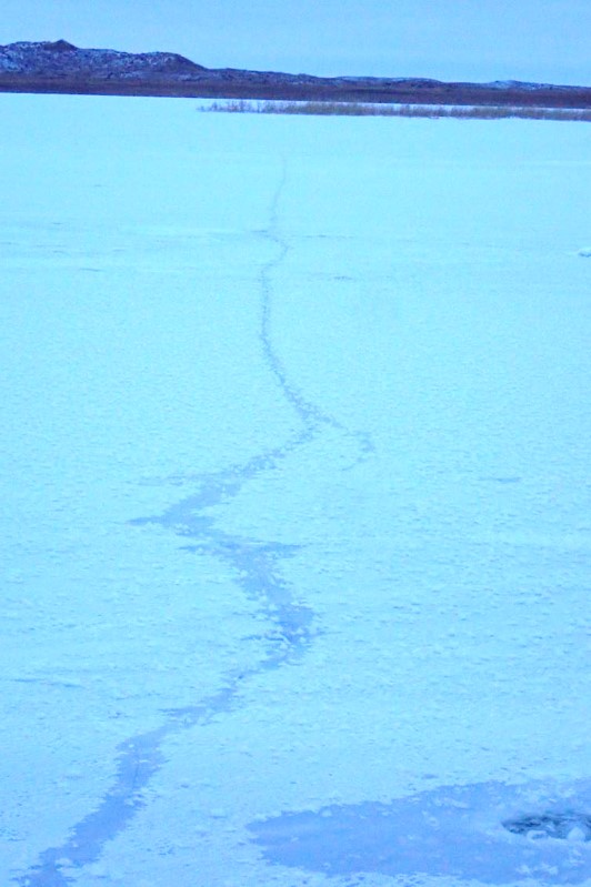 Ice crack on a newly frozen lake.  Photo by Daryl Bauer, Nebraska Game & Parks Commission.