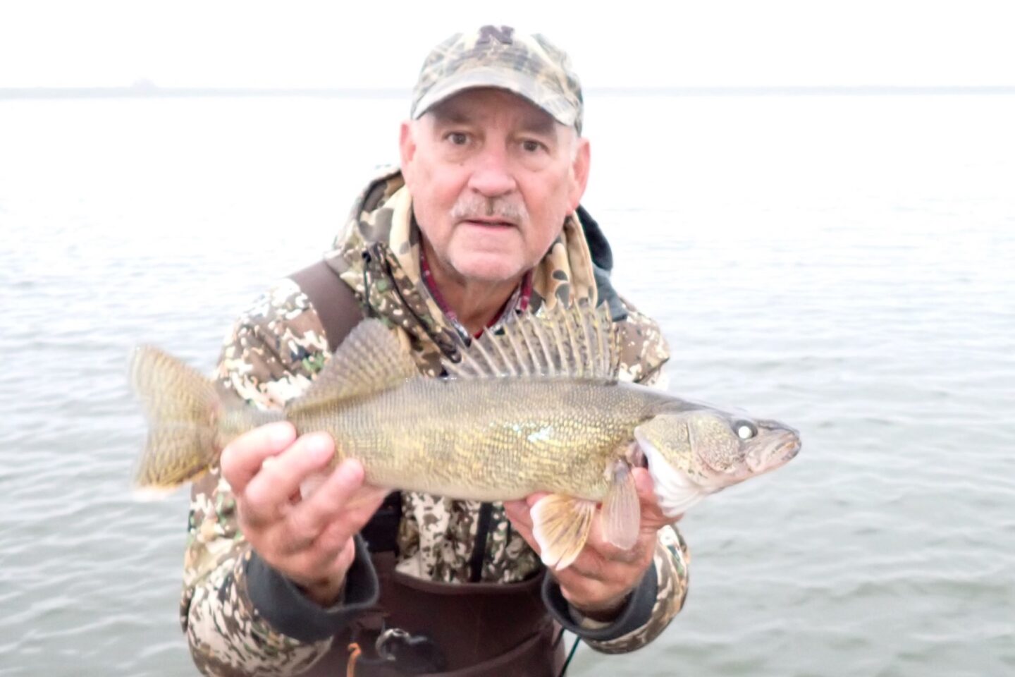 Angler holding saugeye.  Photo by Daryl Bauer, Nebraska Game & Parks Commission.