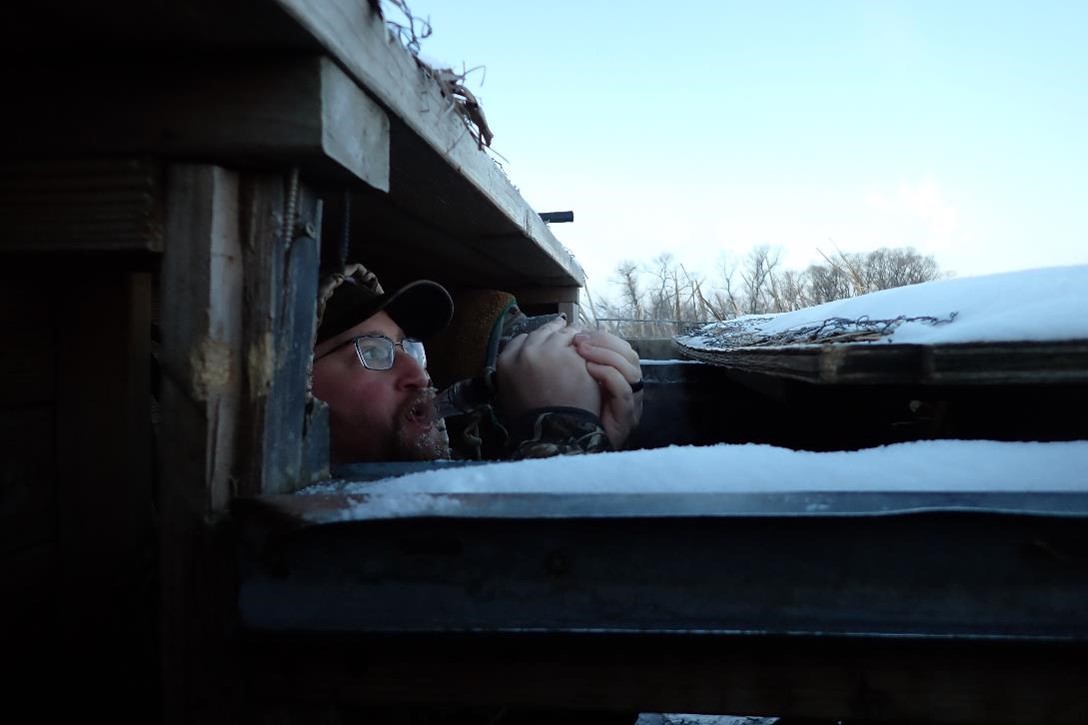 Calling to geese from the blind. Photo by Daryl Bauer, Nebraska Game & Parks Commission.