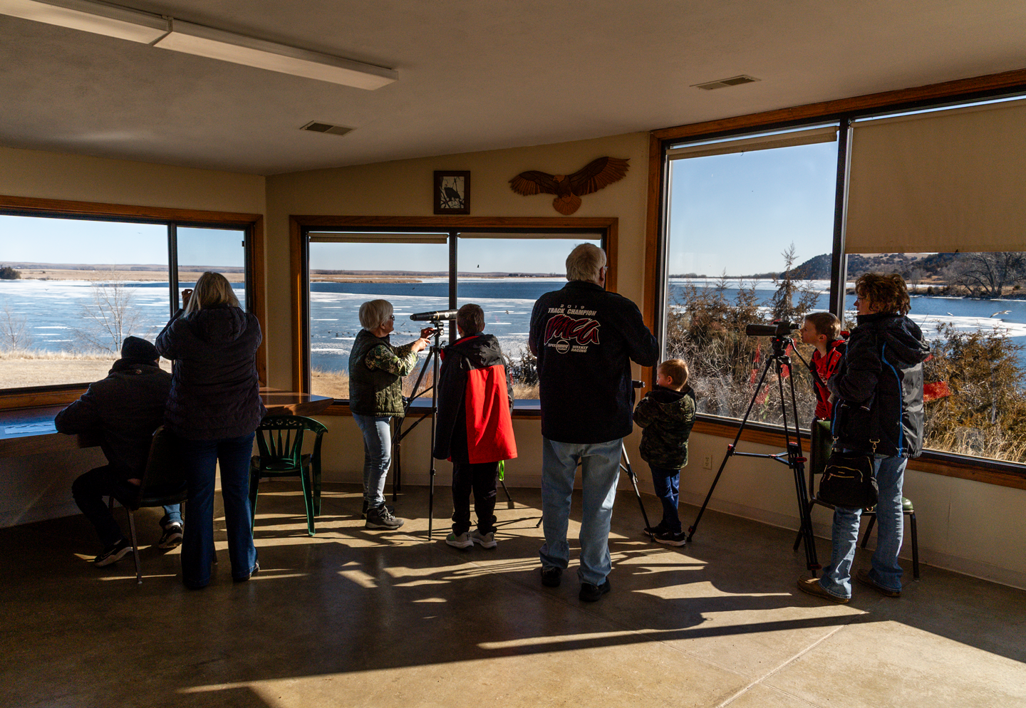 Visitors watch eagles and other fowl from the Central Nebraska Public Power and Irrigation District eagle viewing facility at Lake Ogallala.