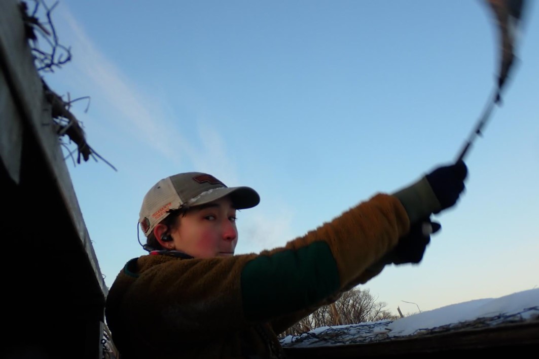 Waving a flag to get geese attention. Photo by Daryl Bauer, Nebraska Game & Parks Commission.
