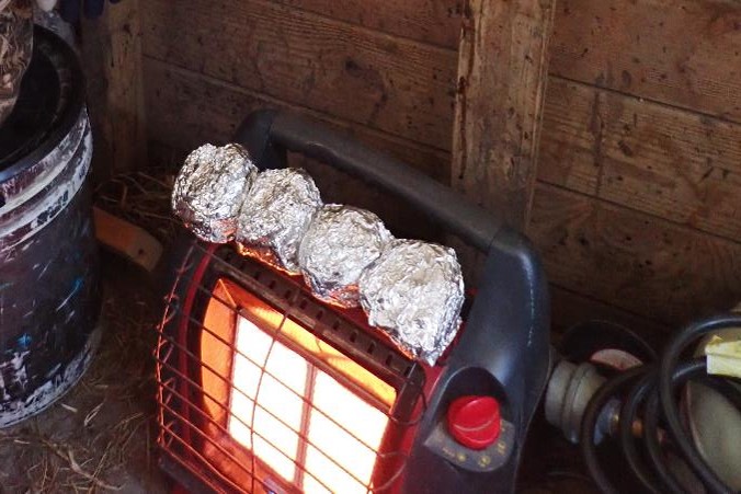 Heater in waterfowl blind, breakfast sandwiches on top. Photo by Daryl Bauer, Nebraska Game & Parks Commission.