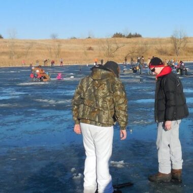 Anglers on ice during an ice fishing clinic. Photo by Daryl Bauer, Nebraska Game & Parks Commission.