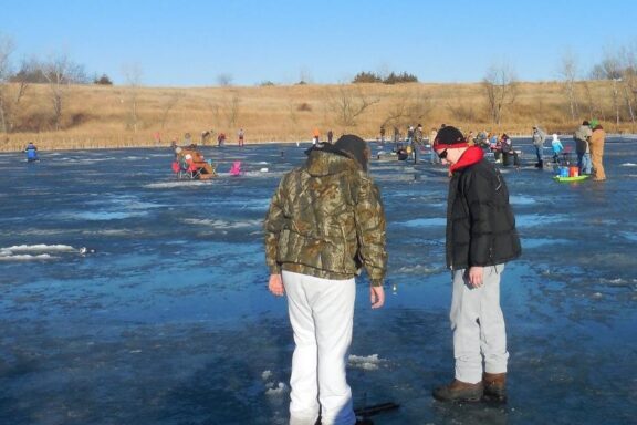 Anglers on ice during an ice fishing clinic. Photo by Daryl Bauer, Nebraska Game & Parks Commission.