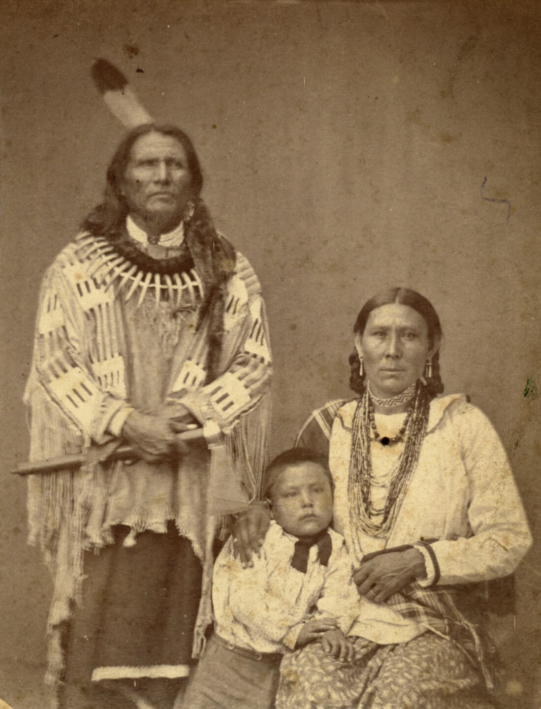 Standing Bear, his wife and one of his sons, 1870s.