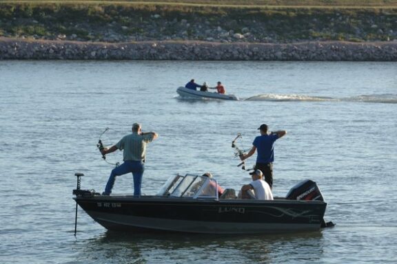 Paddlefish bowfishers below Gavins Point Dam.