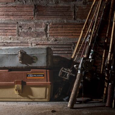 Fishing tackleboxes and rod and reel.