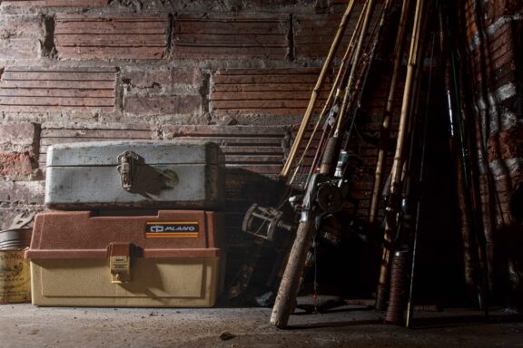 Fishing tackleboxes and rod and reel.