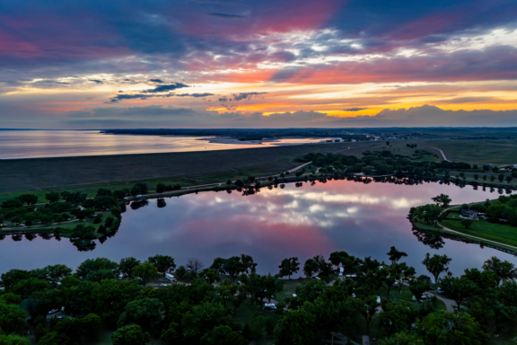 The sun sets a little earlier at Lake Ogallala than it does elsewhere in Keith County, as much as a half hour earlier if you are parked in the west campground of the lake.