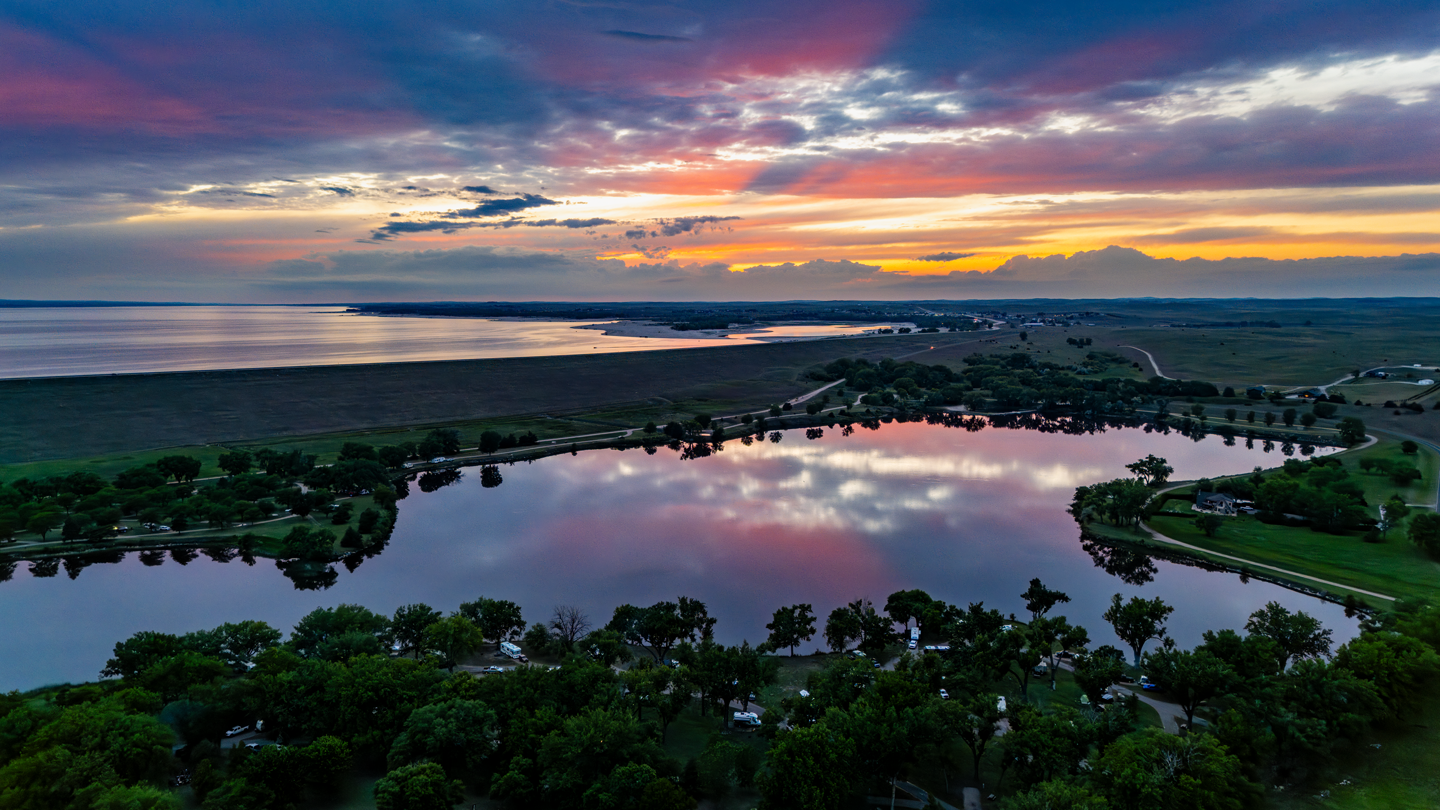 The sun sets a little earlier at Lake Ogallala than it does elsewhere in Keith County, as much as a half hour earlier if you are parked in the west campground of the lake.