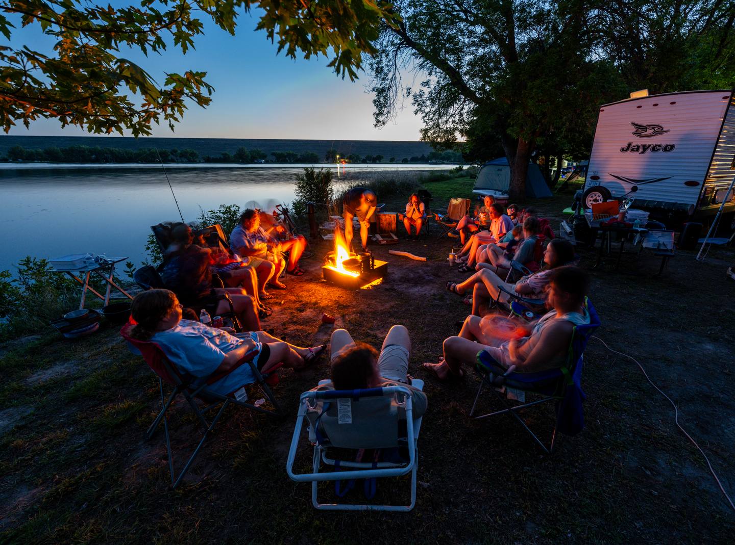 The Parriott family of Murray relaxes around a fire in the east campground.