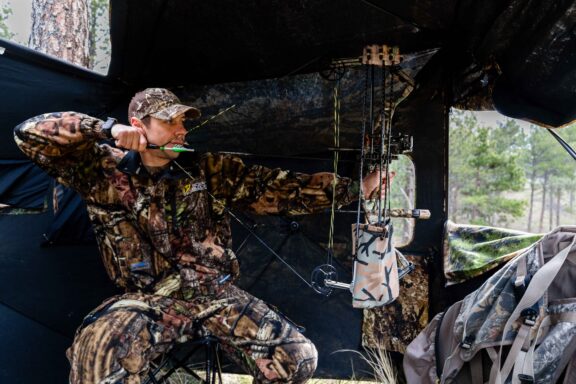 Jacob Chandler of Omaha hunts from a blind using a bow at Chadron State Park in Dawes County.