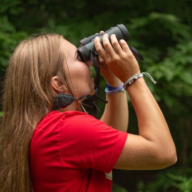 Brylee Rupiper, of Gretna, birdwatching at Louisville State Recreation Area in Cass County.