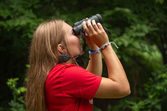 Brylee Rupiper, of Gretna, birdwatching at Louisville State Recreation Area in Cass County.