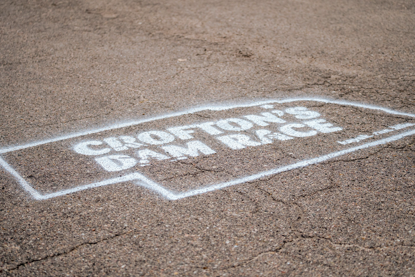 Crofton's Dam Race logo spray painted onto the pavement.