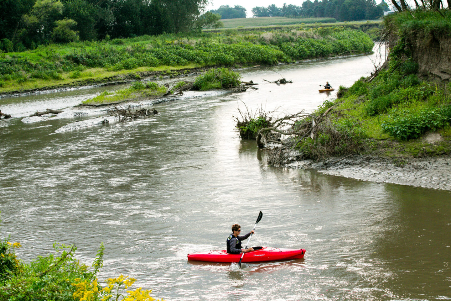 Kayakers float Logan Creek, also known as “the dredge,” in Thurston County.