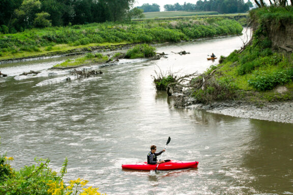 Kayakers float Logan Creek, also known as “the dredge,” in Thurston County.