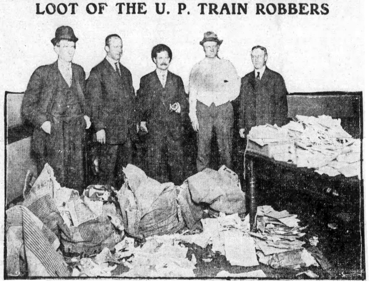 Post Office inspectors with the stolen mail sacks found in the attic of Brown Park Elementary School. Omaha Daily News, May 29, 1909.