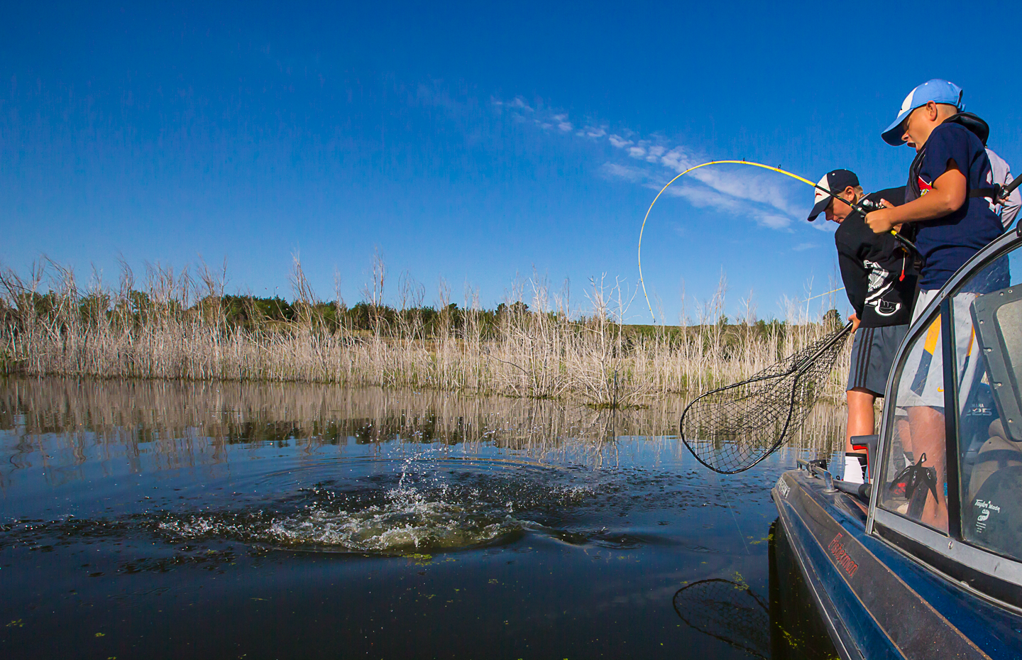 Tate Florell from Holdrege learns 
when the water level of the lake 
rises in the late spring, flooded vegetation is the place to fish.