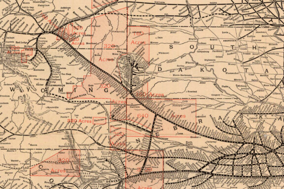 Detail of a map from a 1912 brochure, free government lands in Nebraska, Colorado, Wyoming, Montana and South Dakota along the Burlington Route. Red areas show regions eligible for the Kinkaid Act (640 acres) and the Enlarged Homestead Act (320 acres). NSHS M78 1912 B961H.