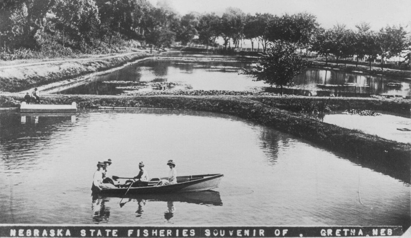 A group of women paddle a row boat across the hatchery ponds at Schramm Education Center, formerly Ak-Sar-Ben Aquarium, at Schramm Park State Recreation Area.