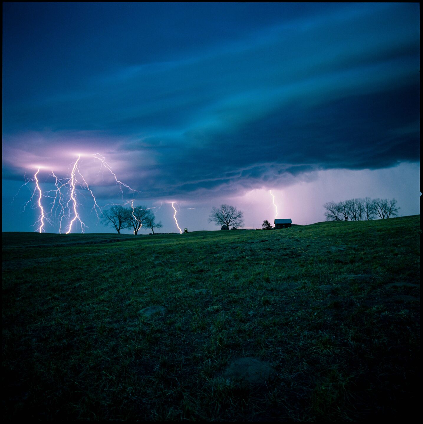 Ken Bouc witnessed multiple lightning strikes above an old farmstead.
