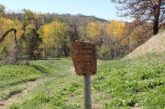 Sign to Soldier Creek Wilderness Area. Has an artistic, fired look to it now. Photo by Daryl Bauer, Nebraska Game & Parks Commission.