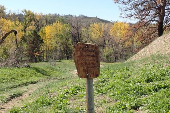 Sign to Soldier Creek Wilderness Area. Has an artistic, fired look to it now. Photo by Daryl Bauer, Nebraska Game & Parks Commission.